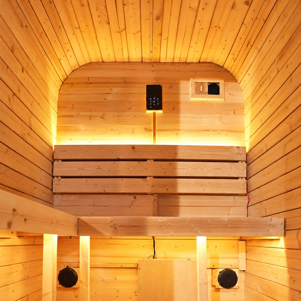 Rear timber bench and three-slat backrest inside the compact spruce sauna, with warm lighting.