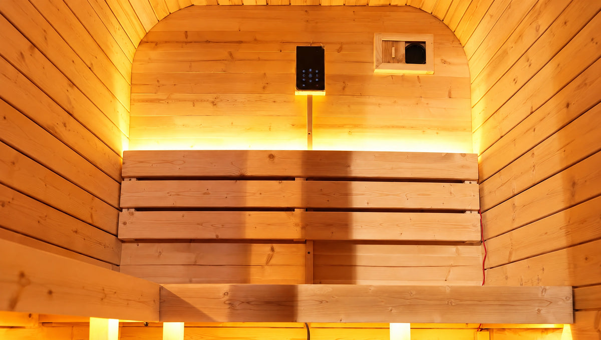 Wide detail of three timber backrest slats, the rear bench and warm lighting.
