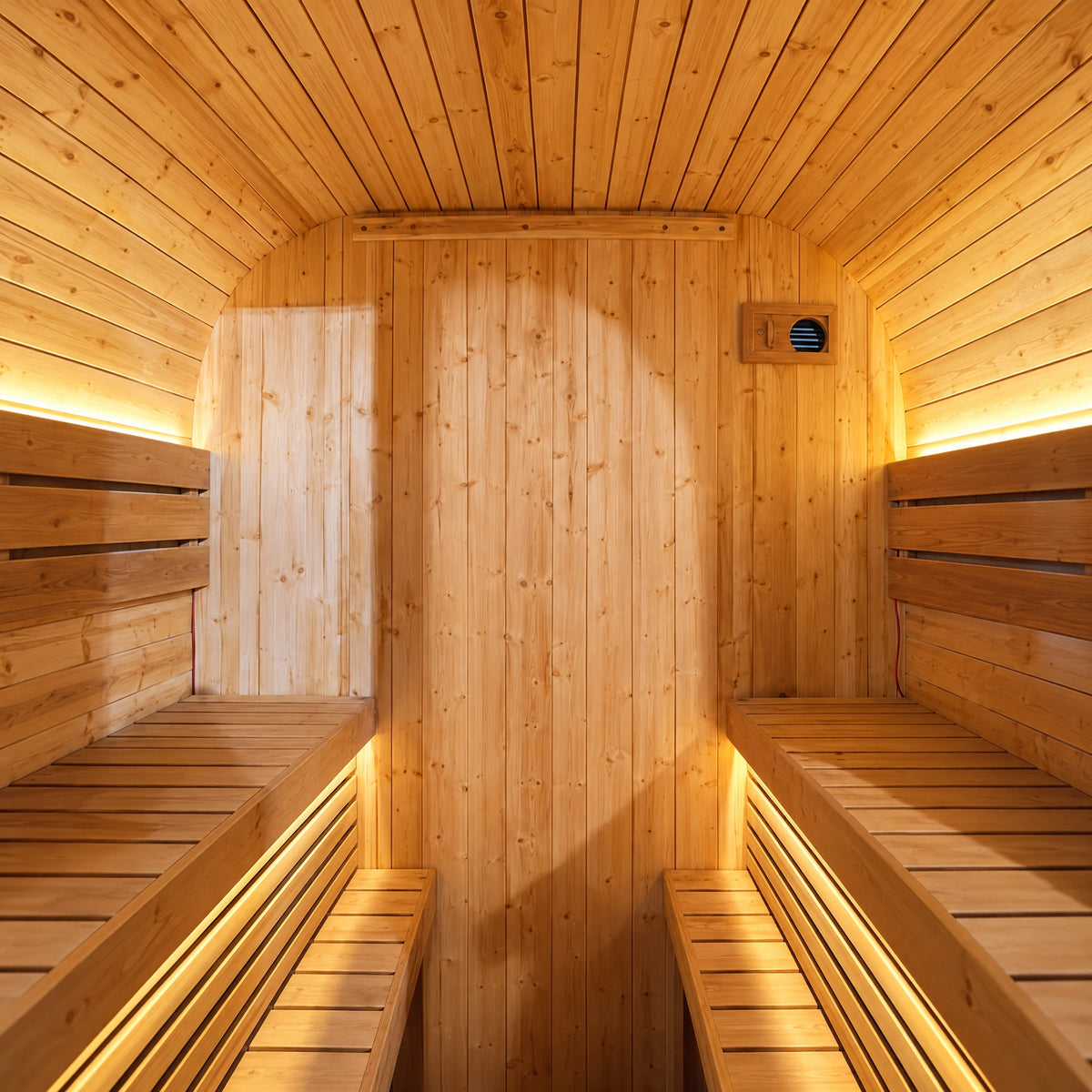 Interior view of opposing upper benches and lower footstep strips with an open center passage.