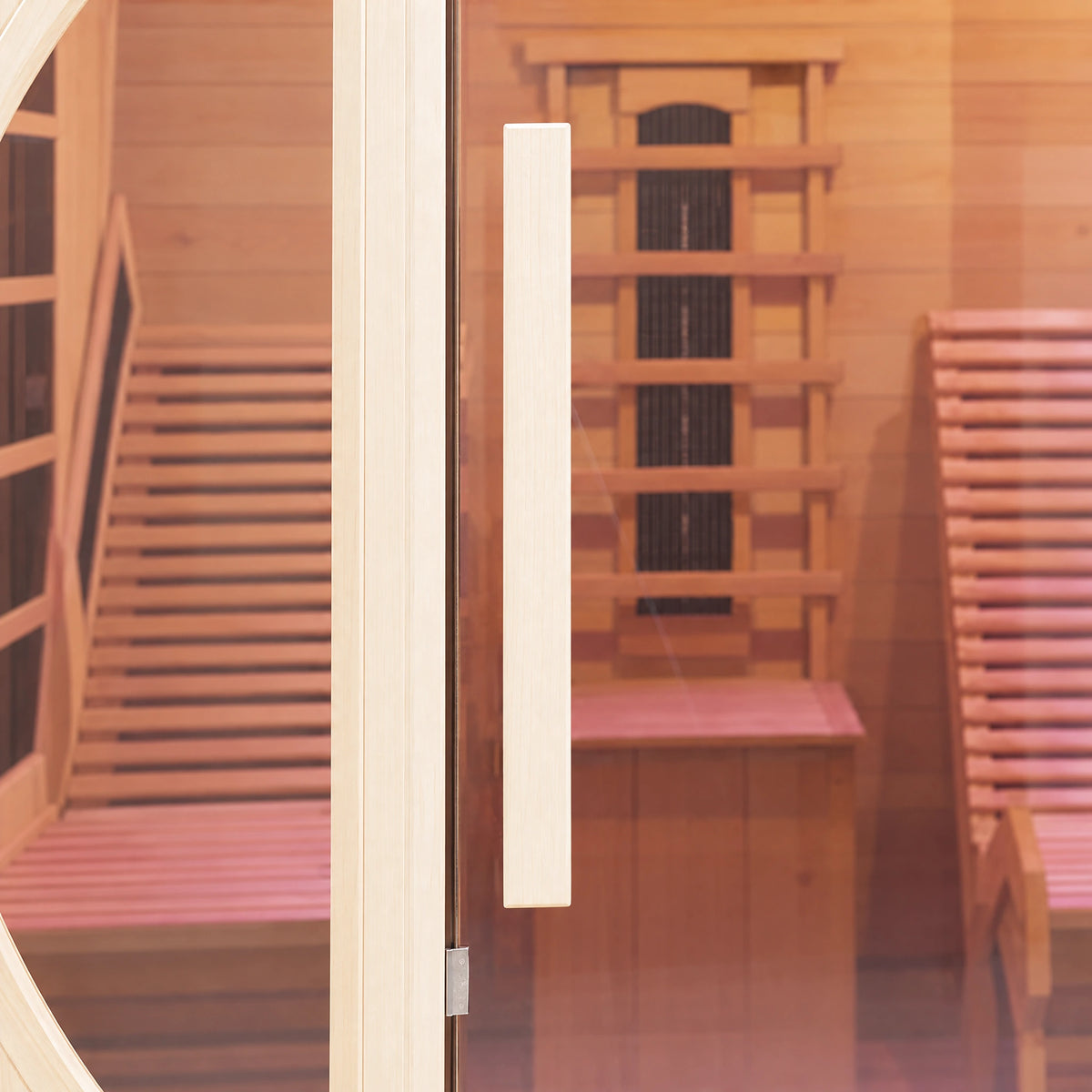 Long vertical timber pull beside the sauna’s central glass door.