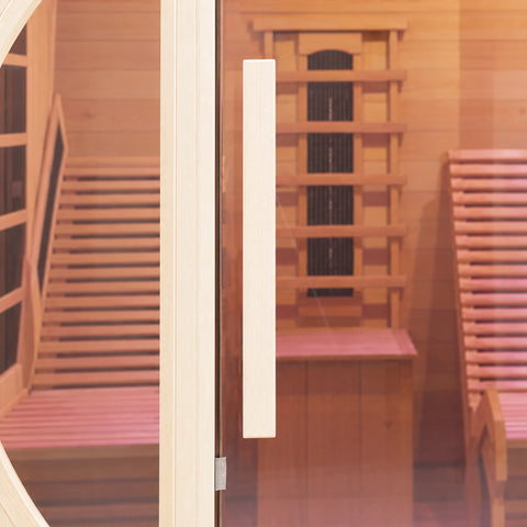Long vertical timber pull beside the sauna’s central glass door.